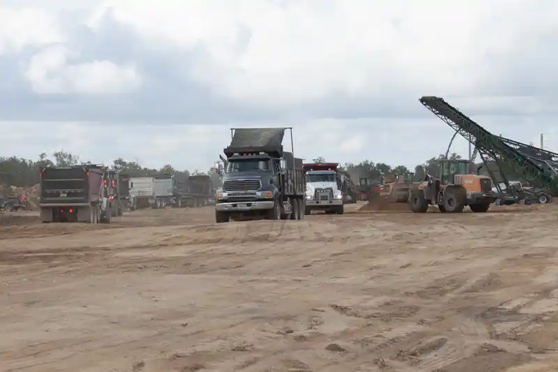 SMG, Inc. screener and dump truck loading operations.