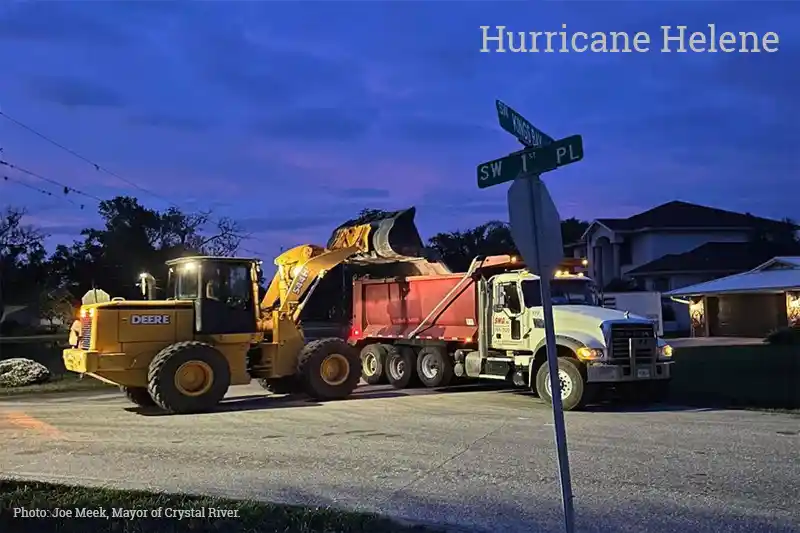 SMG, Inc. debris haulers working into the night off Kings Bay Drive, Crystal River, FL post Hurricane Helene.
